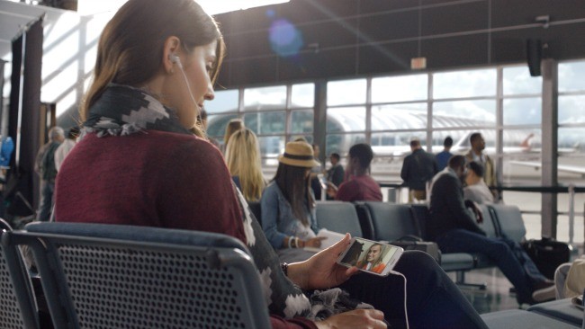 Woman watching Netflix on phone